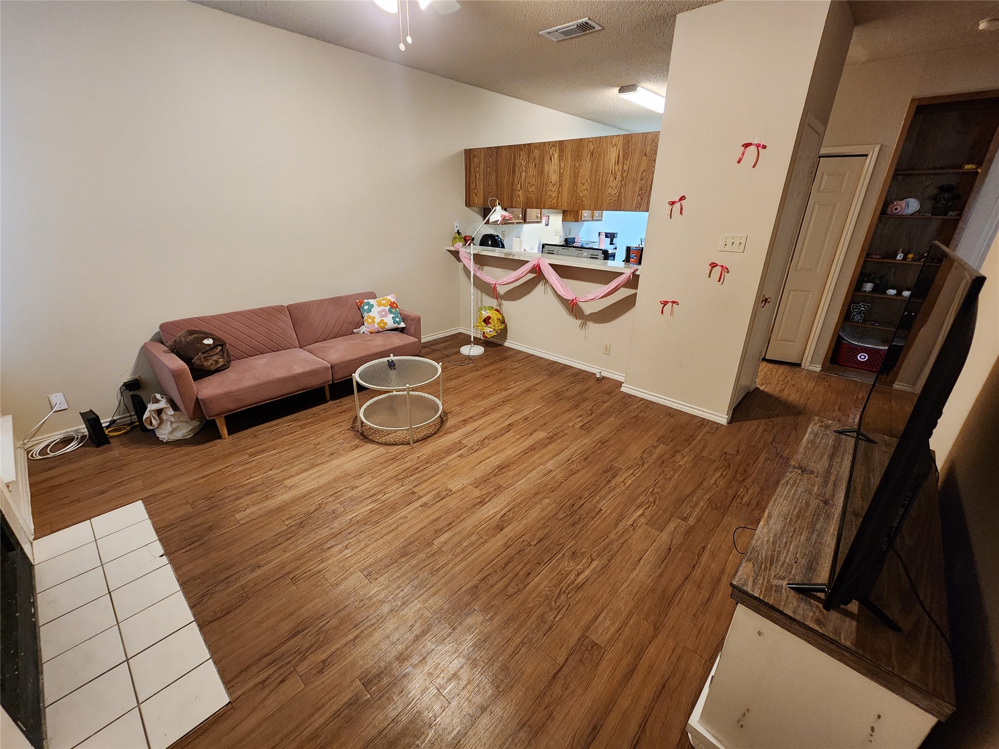 2414 Longview Street, Unit 306 Austin, TX 78705 - Photo 2 of 14 a living room with furniture and a flat screen tv
