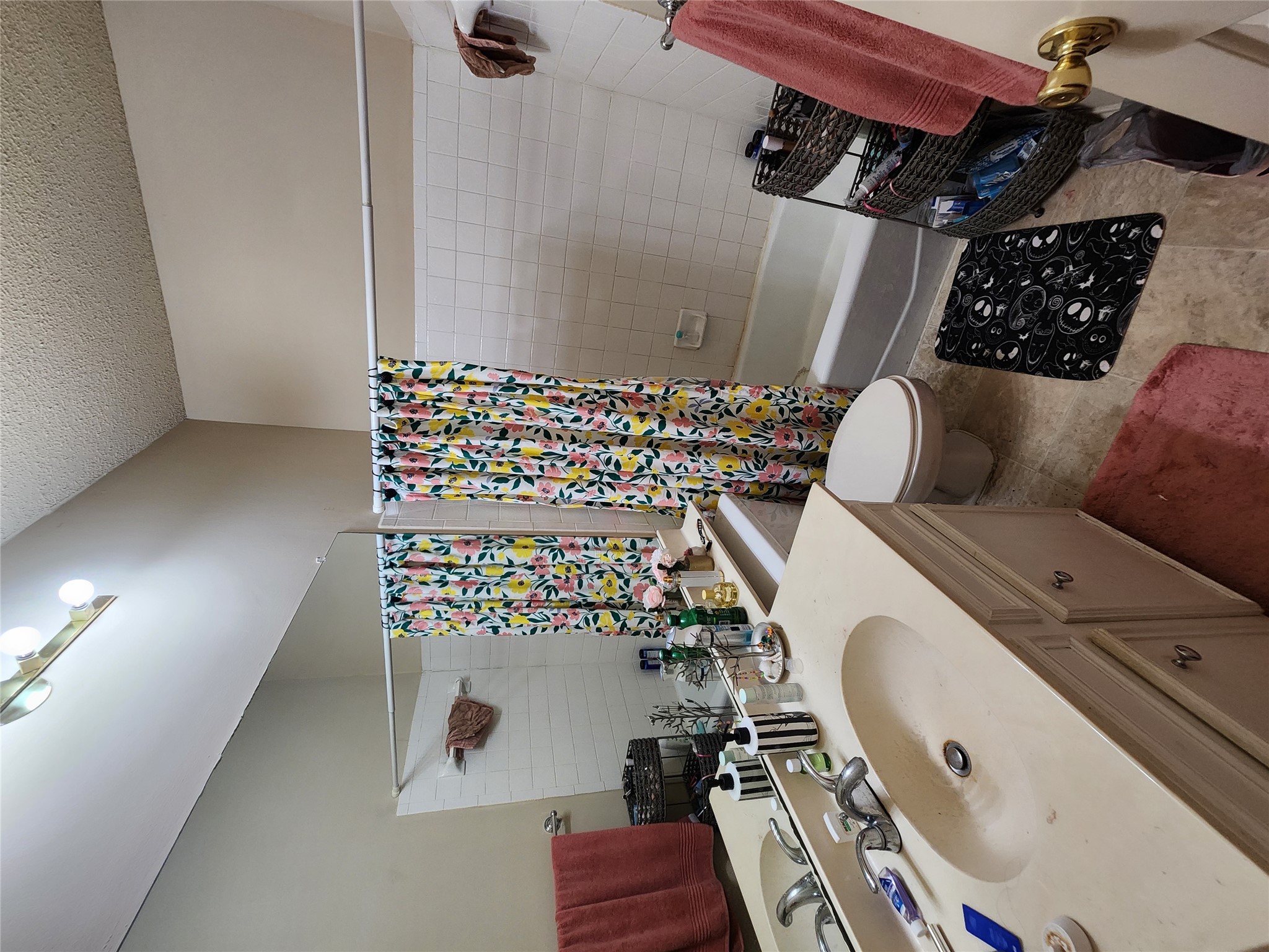 2414 Longview Street, Unit 306 Austin, TX 78705 - Photo 8 of 14 a bathroom with a sink toilet tub and shower