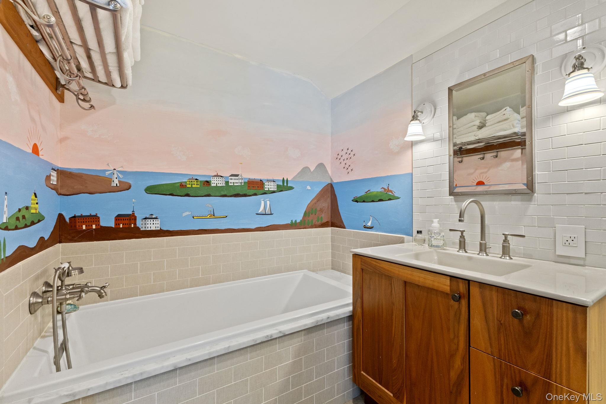 8 South Bedford Road Pound Ridge, NY 10576 - Photo 21 of 32 a bathroom with a bathtub sink and mirror