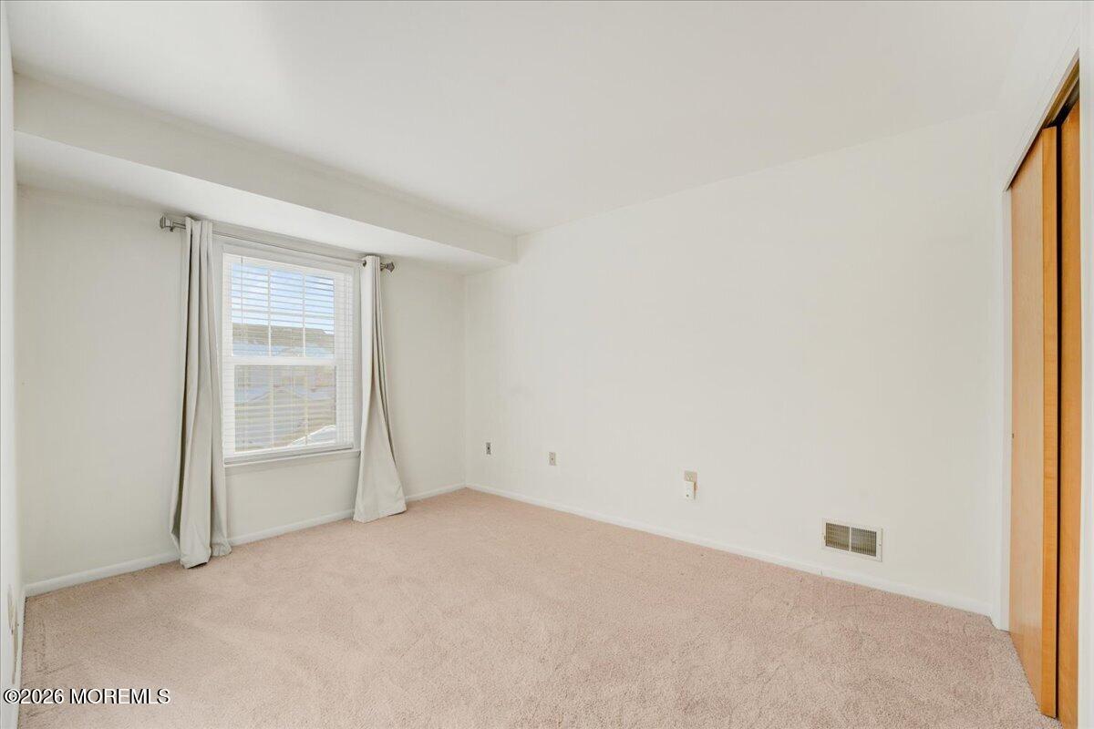 46 Stony Hill Road Jamesburg, NJ 08831 - Photo 16 of 23 a view of an empty room with a window