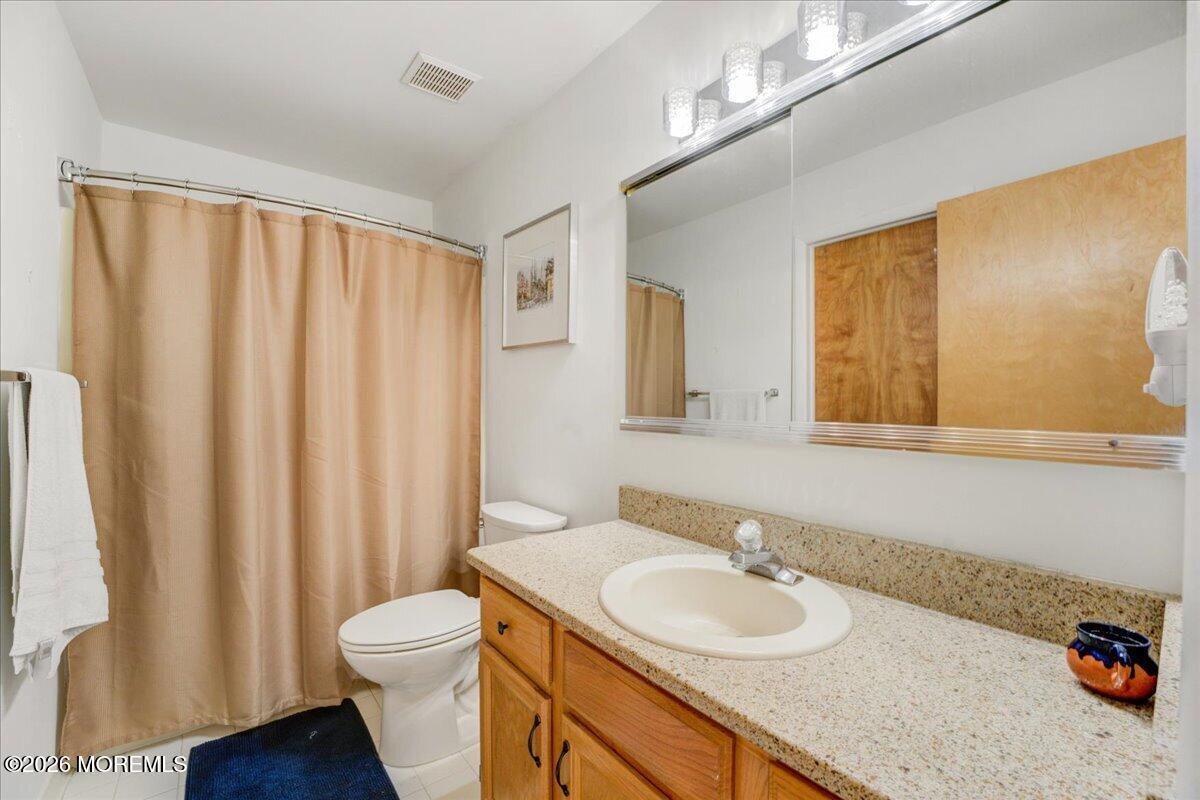 46 Stony Hill Road Jamesburg, NJ 08831 - Photo 17 of 23 a bathroom with a granite countertop sink and a mirror