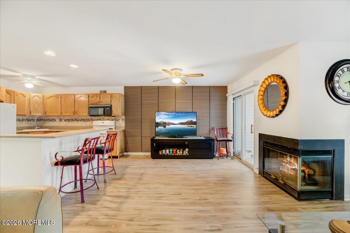 46 Stony Hill Road Jamesburg, NJ 08831 - Photo 5 of 23 a living room with furniture and a fireplace