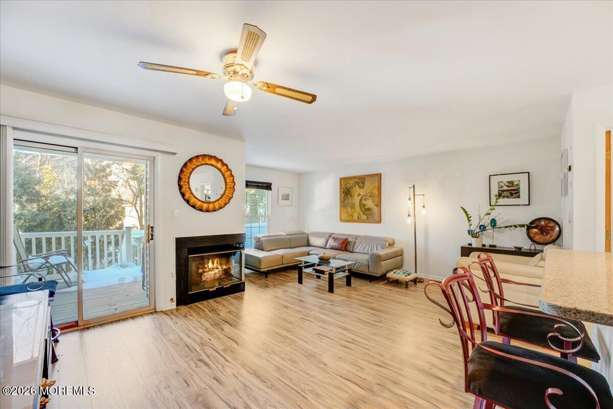 46 Stony Hill Road Jamesburg, NJ 08831 - Photo 6 of 23 a living room with furniture a fireplace and a window