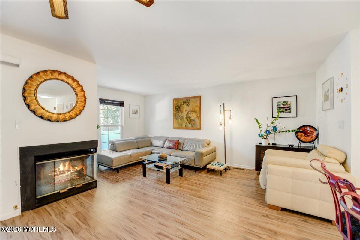 46 Stony Hill Road Jamesburg, NJ 08831 - Photo 7 of 23 a living room with furniture and a fireplace