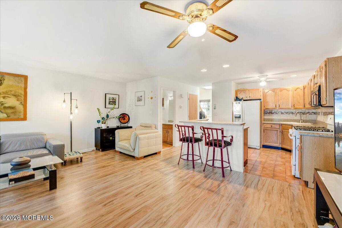 46 Stony Hill Road Jamesburg, NJ 08831 - Photo 9 of 23 a living room with furniture and kitchen view