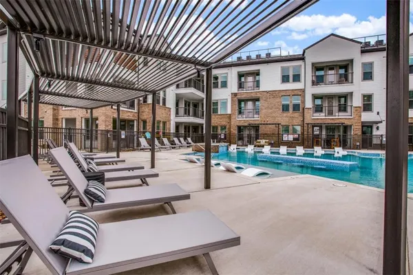 a building outdoor space with patio furniture and potted plants