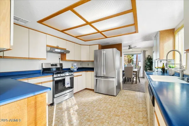 a bathroom with a sink a mirror and a toilet