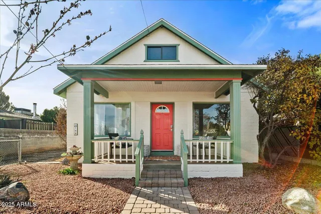 a outdoor space with a couch and chairs