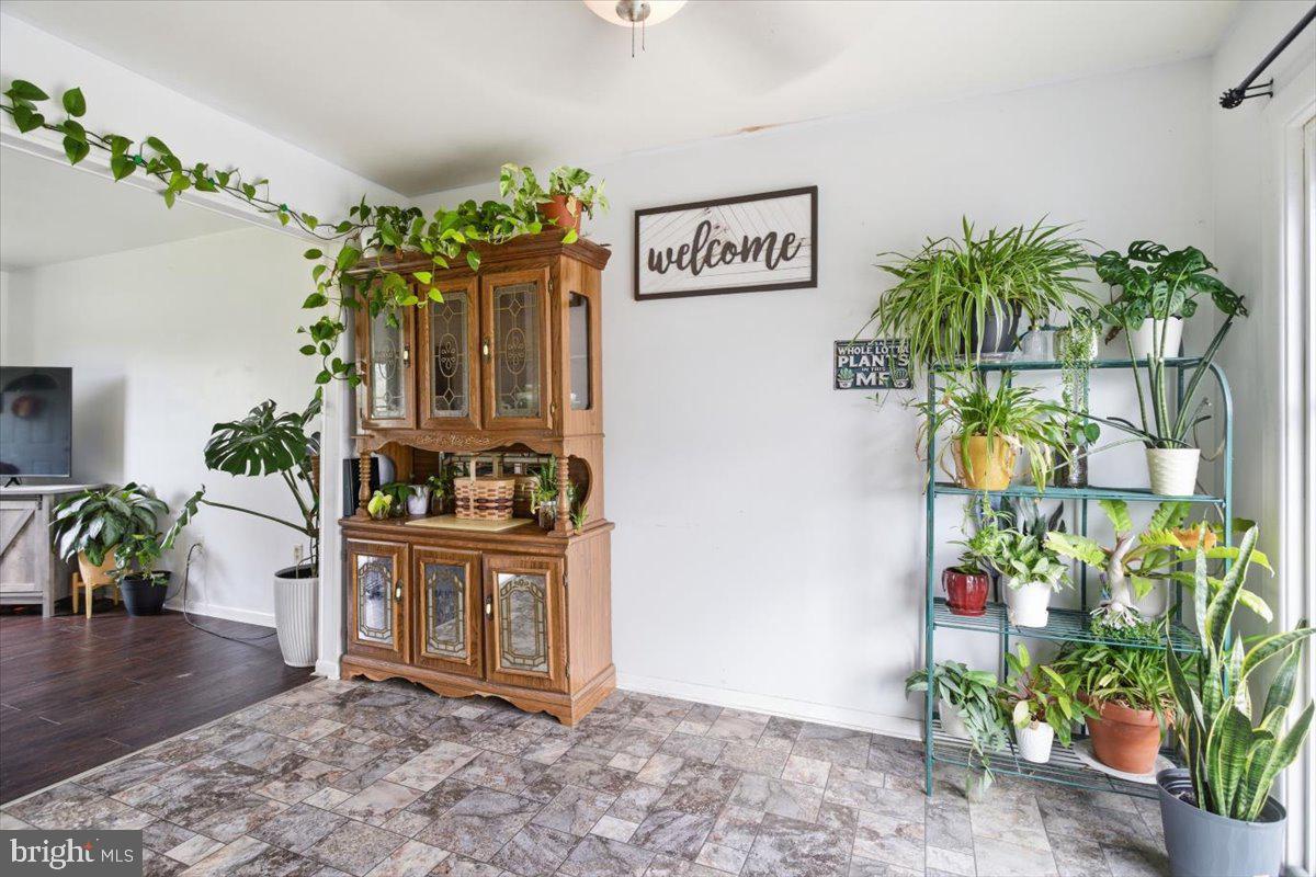15421 Oakland Road Goldsboro, MD 21636 - Photo 4 of 20 a view of a hallway with painting and a potted plant