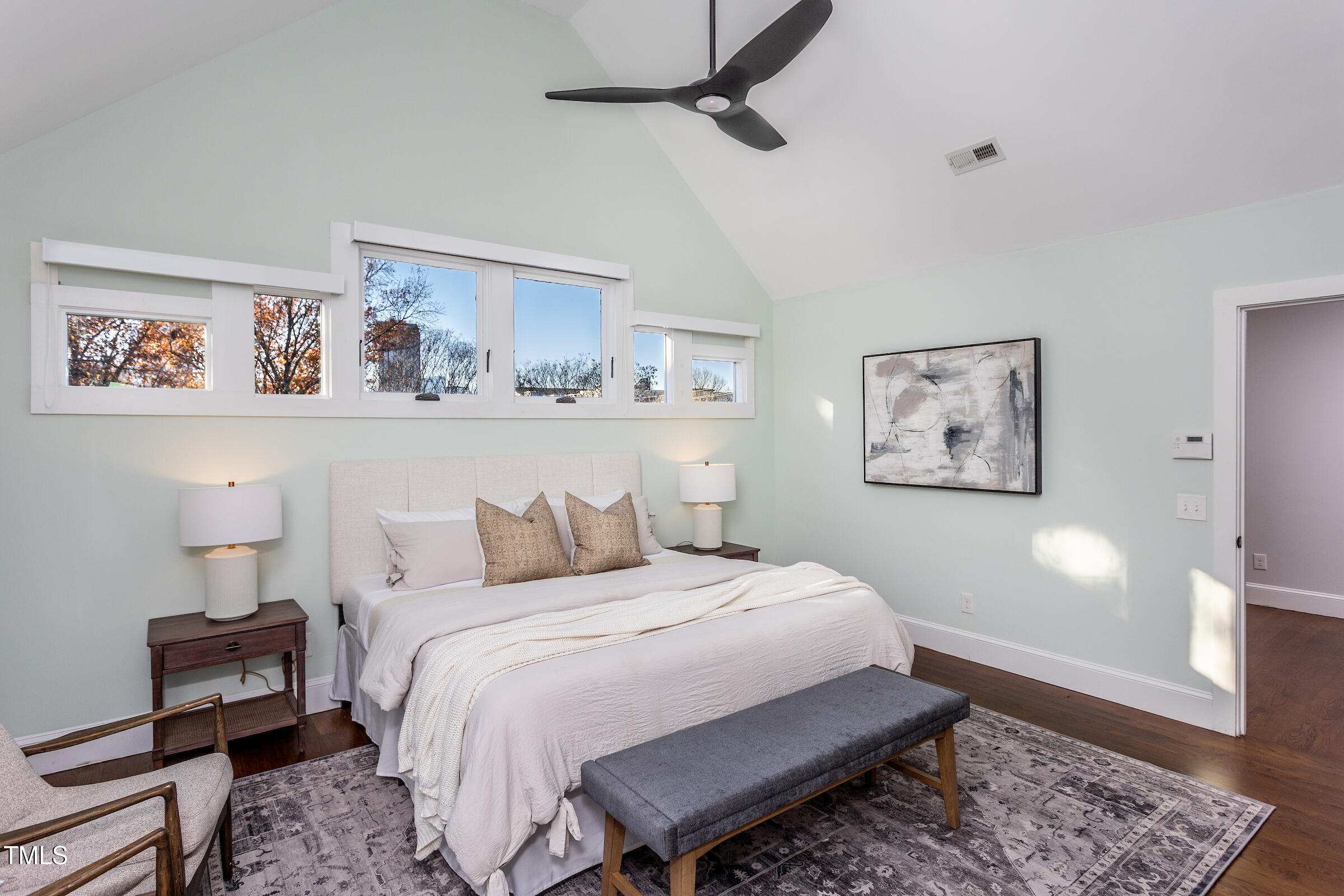 542 East Martin Street Raleigh, NC 27601 - Photo 18 of 45 a bedroom with a bed and a night stand