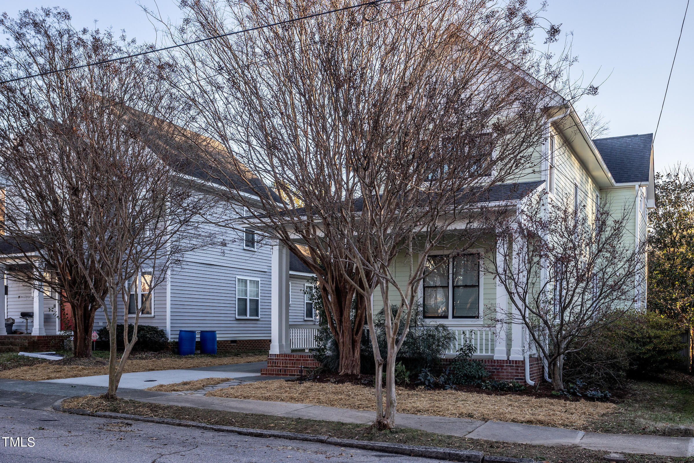 542 East Martin Street Raleigh, NC 27601 - Photo 2 of 45 a tree in front of a white house