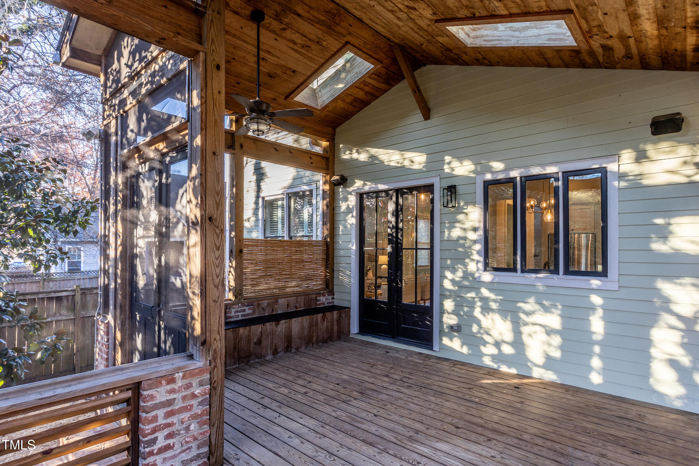 542 East Martin Street Raleigh, NC 27601 - Photo 24 of 45 a view of a porch with wooden floor and stairs