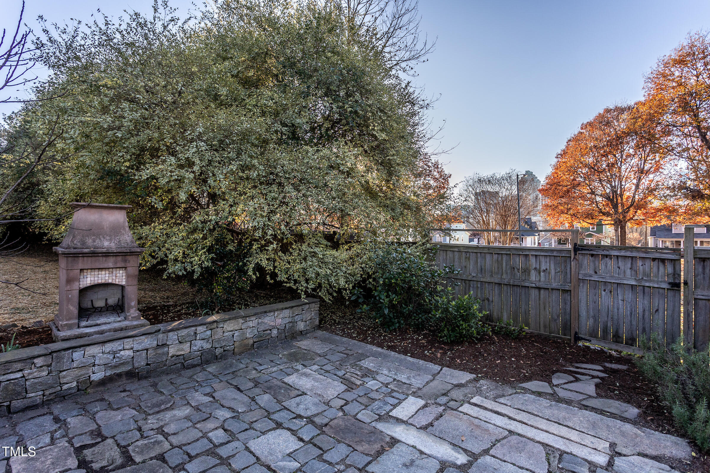 542 East Martin Street Raleigh, NC 27601 - Photo 28 of 45 a view of a backyard with plants and wooden fence
