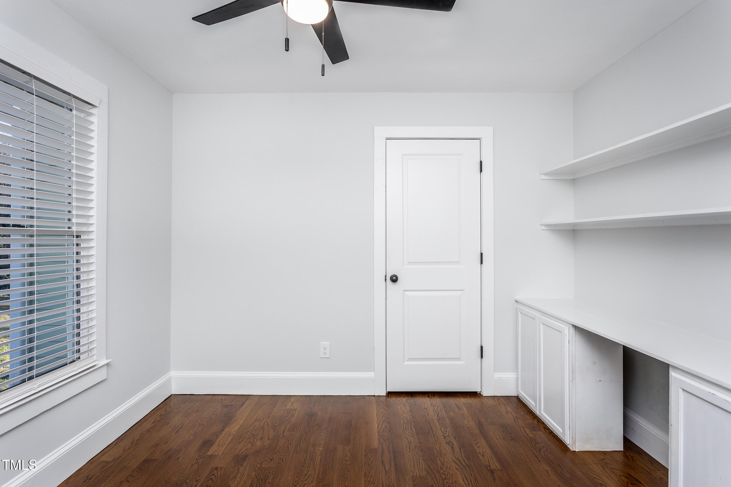 542 East Martin Street Raleigh, NC 27601 - Photo 38 of 45 a view of an empty room with wooden floor and a window
