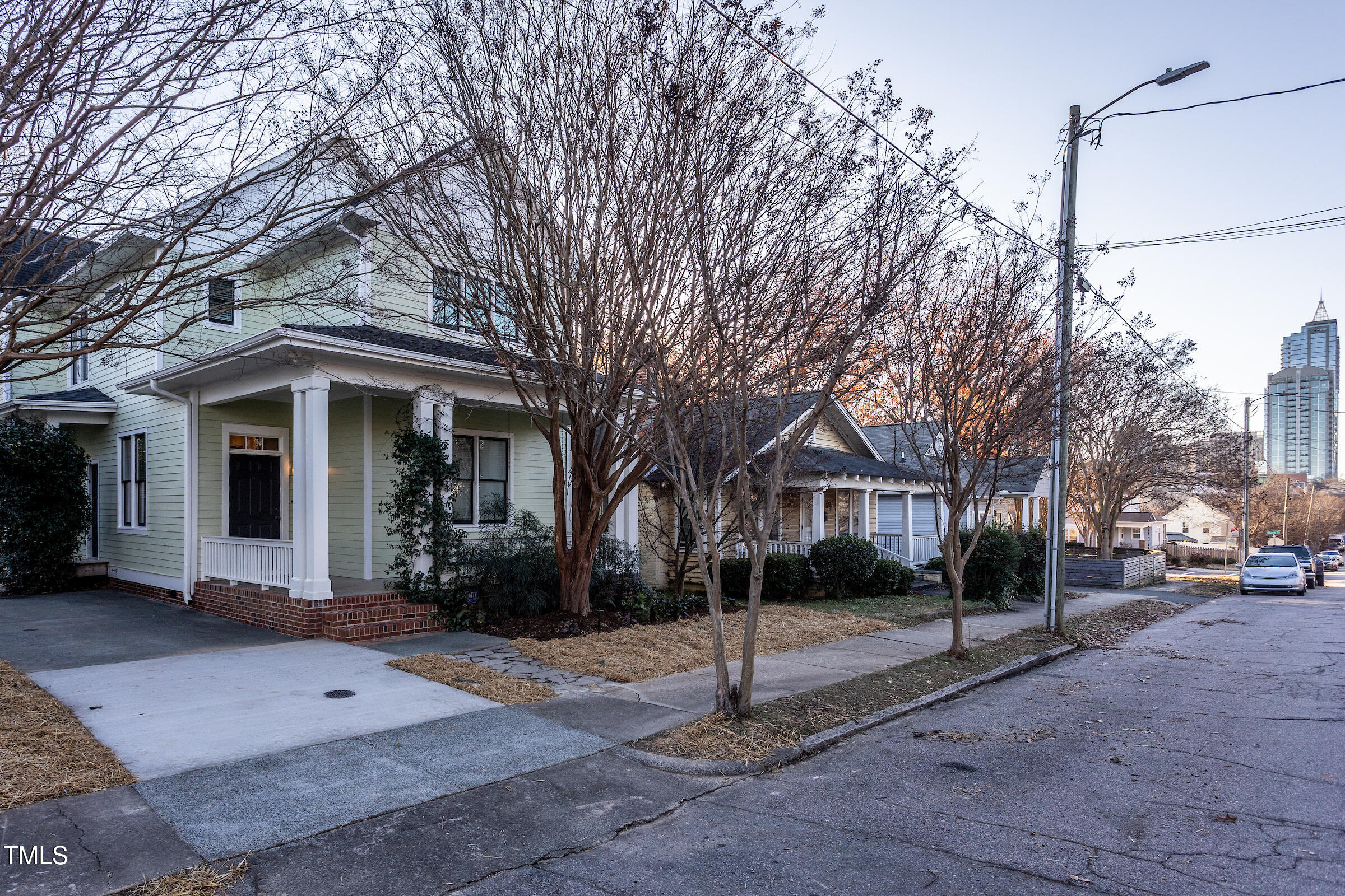 542 East Martin Street Raleigh, NC 27601 - Photo 45 of 45 a view of a white house with a large tree
