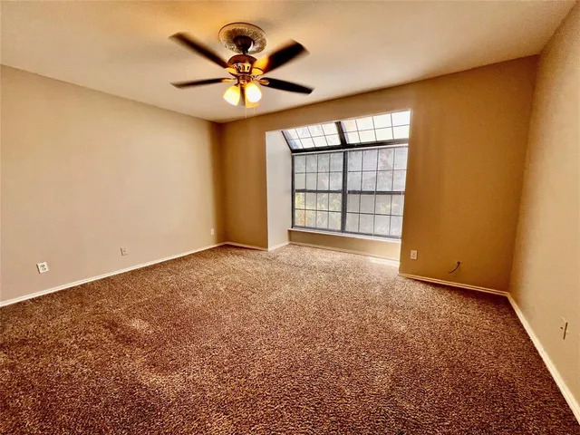 a view of a hallway with a dining room