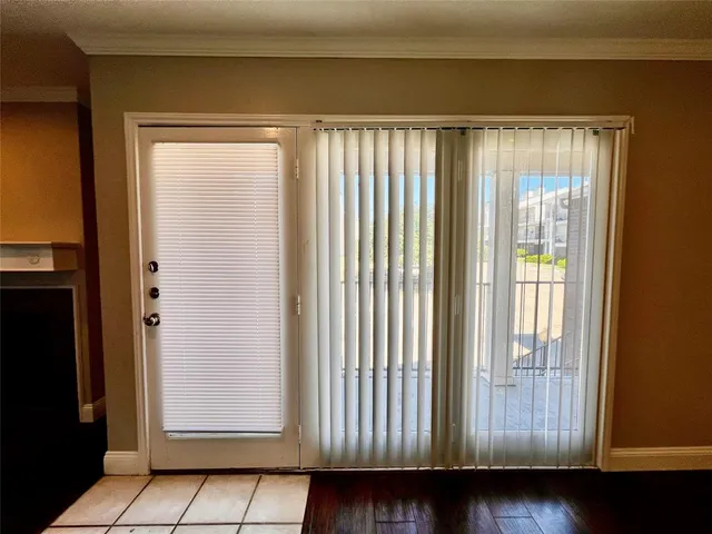 a view of front door with wooden floor