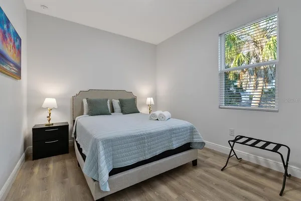 a bedroom with a bed and window