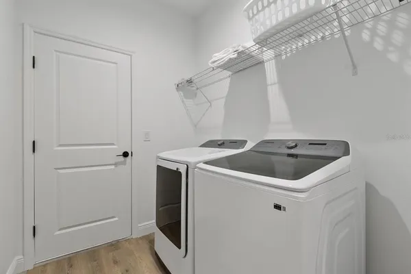 a utility room with dryer and washer