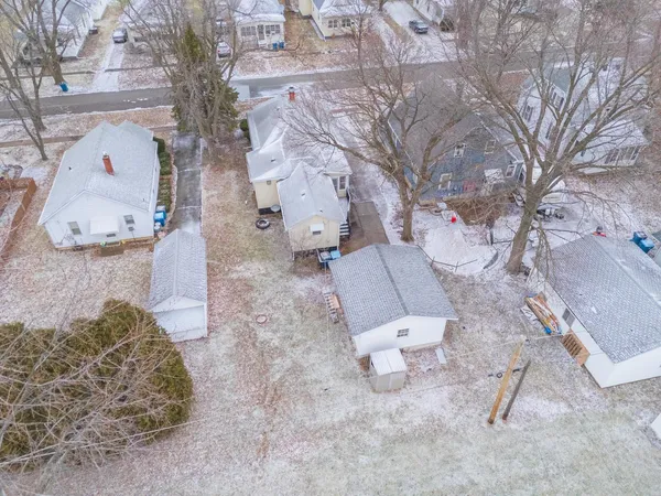 a white toilet sitting in a backyard