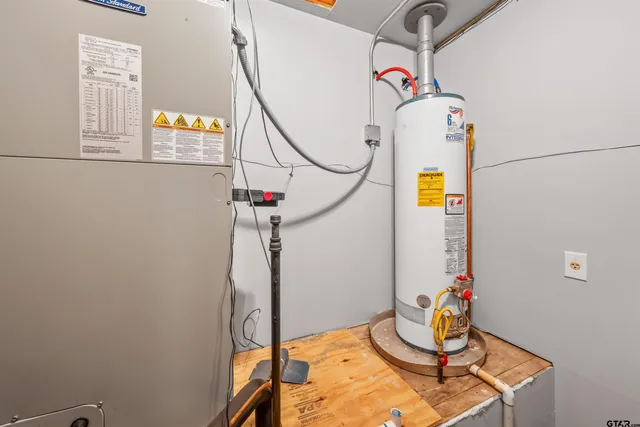 a utility room with a sink and dishwasher