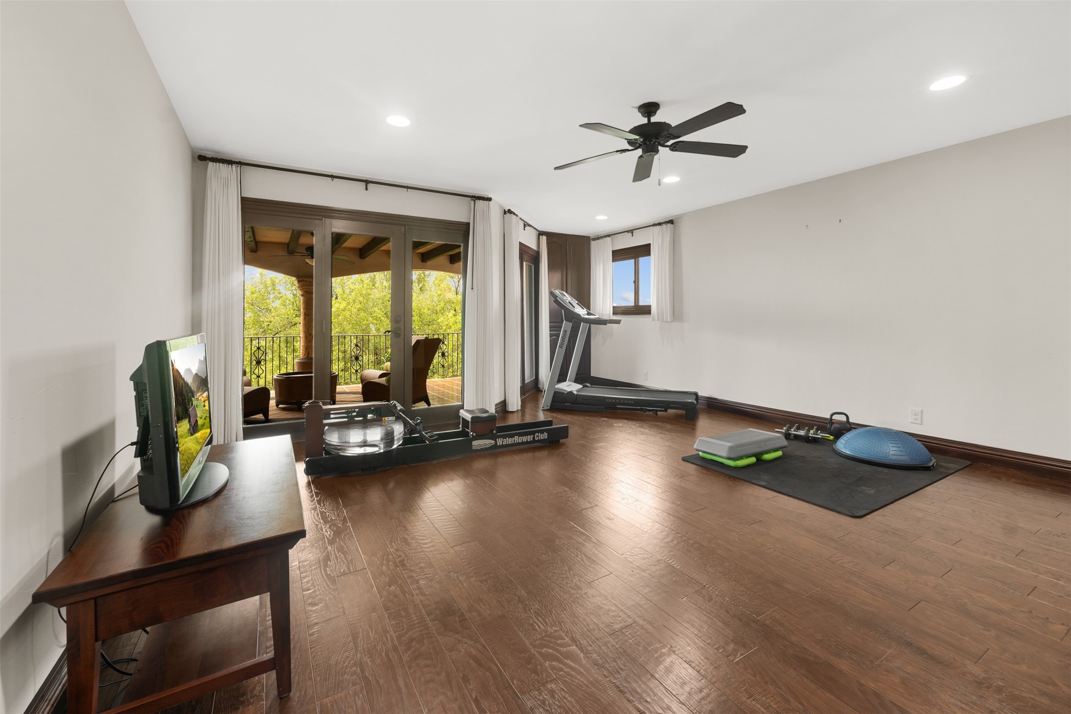 34000 Smithson Valley Road Bulverde, TX 78163 - Photo 25 of 50 This spacious flex room offers endless possibilities as a fitness studio, game room, media room, or private retreat. French doors open to a covered balcony, creating a bright and versatile living space.