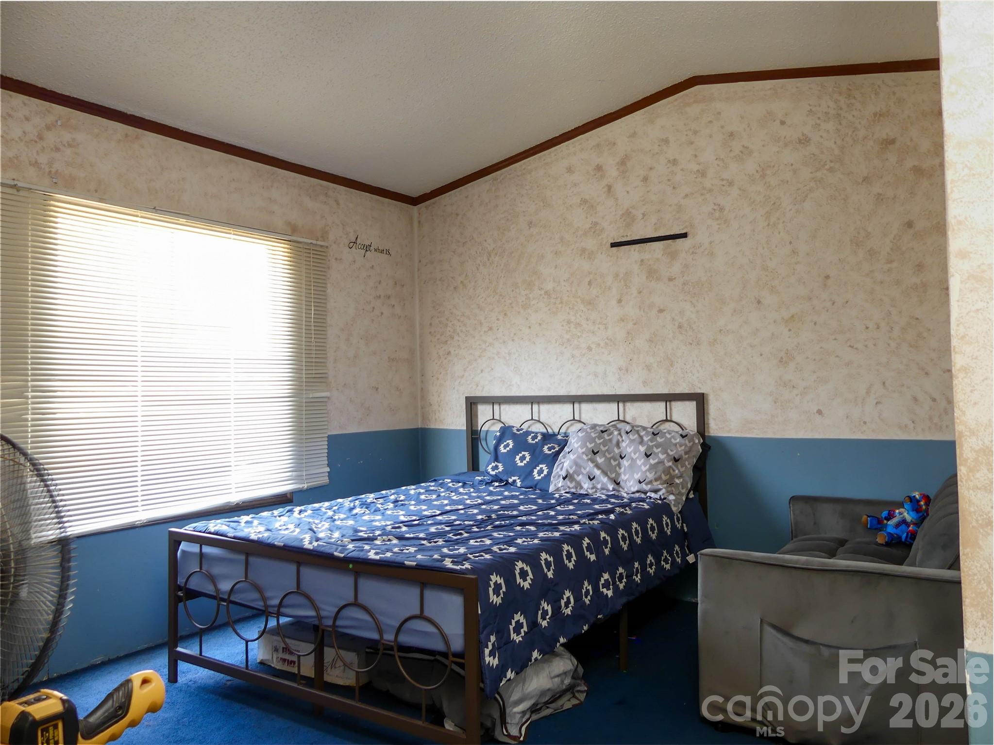 1490 Glenn Carlton Road Boomer, NC 28606 - Photo 5 of 14 a bedroom with a bed a dresser and a window