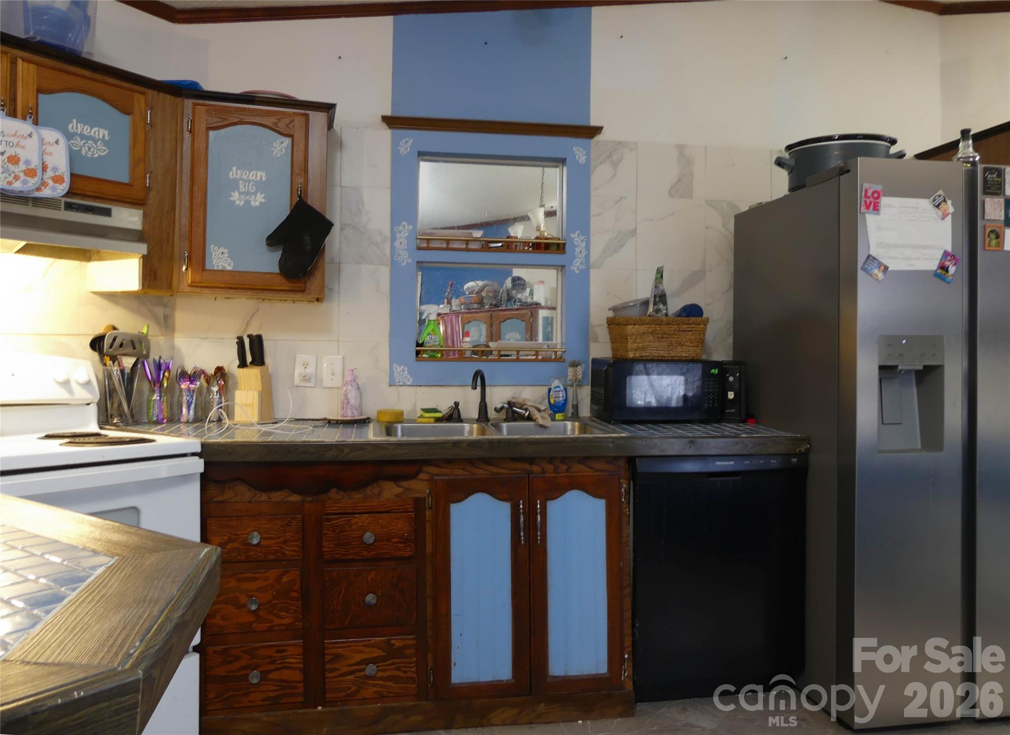 1490 Glenn Carlton Road Boomer, NC 28606 - Photo 7 of 14 a kitchen with stainless steel appliances granite countertop a refrigerator and a sink