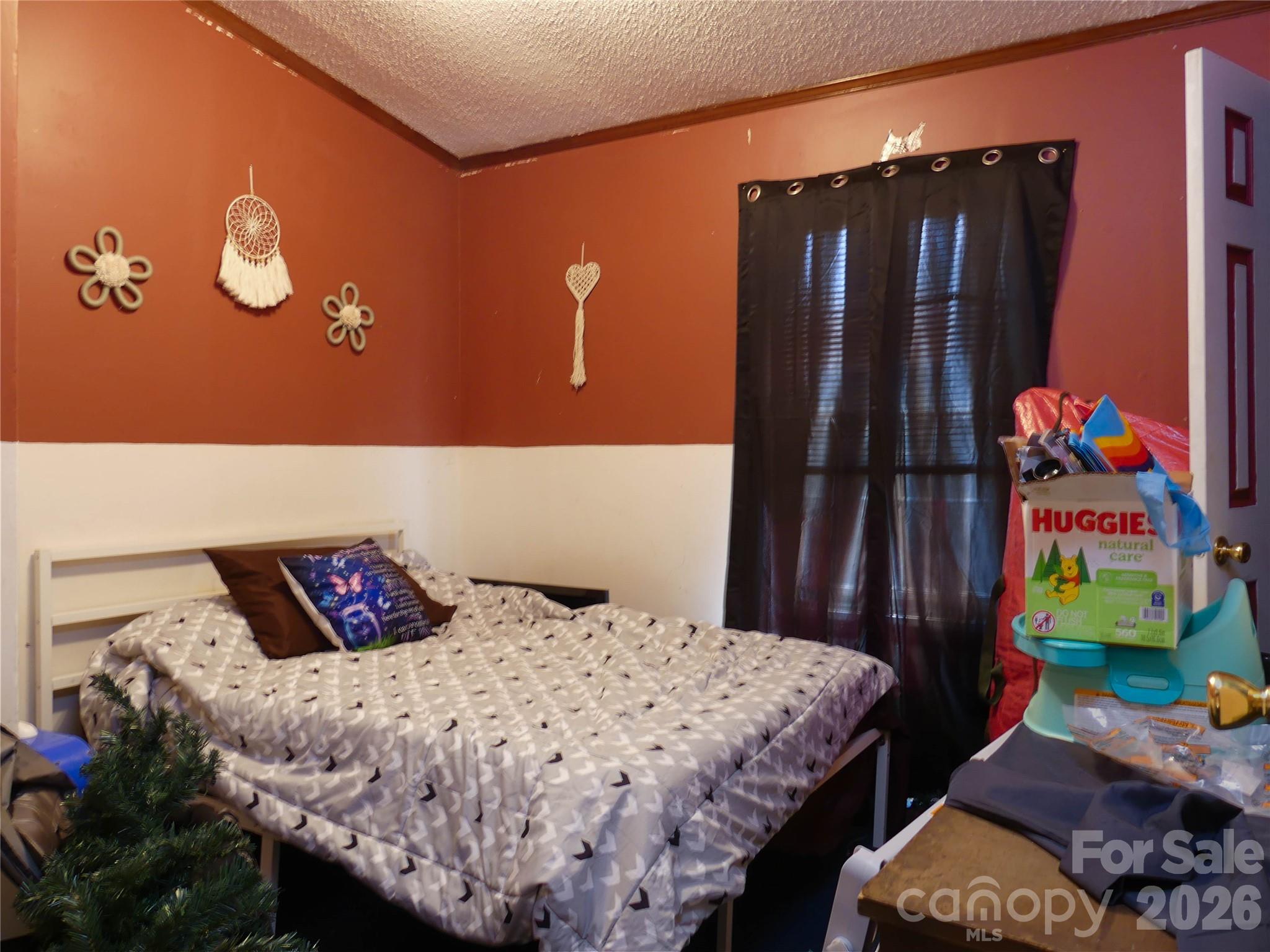 1490 Glenn Carlton Road Boomer, NC 28606 - Photo 10 of 14 a bedroom with a bed and a dresser