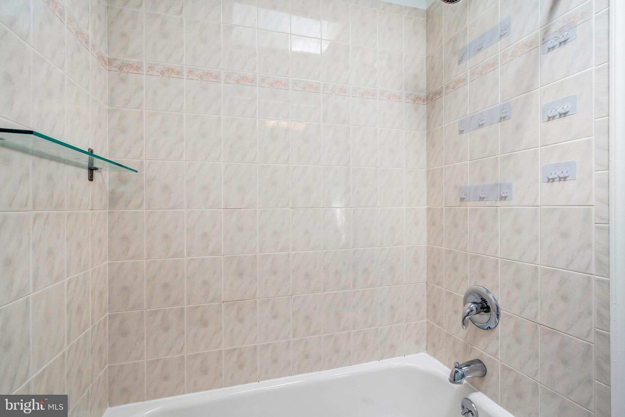 1749 L Street Northeast Washington, DC 20002 - Photo 17 of 24 a bathroom with a shower and a bath tub