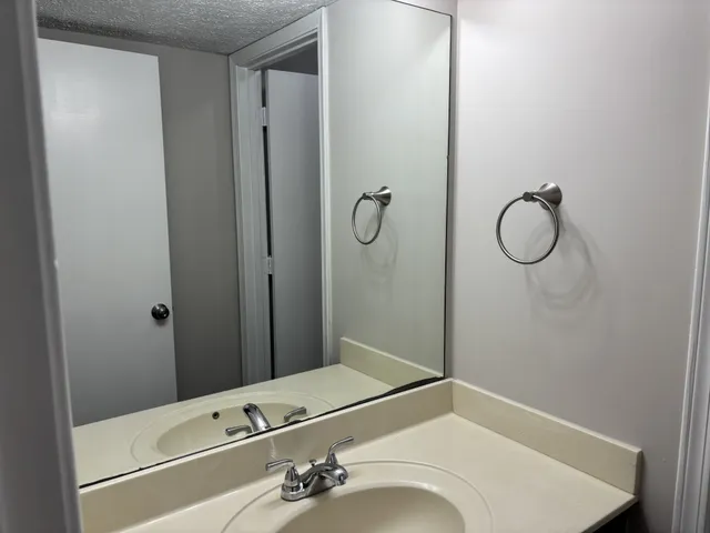 a bathroom with a tub and a sink