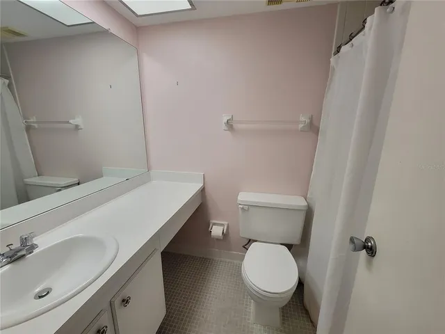 a bathroom with a shower and a bath tub