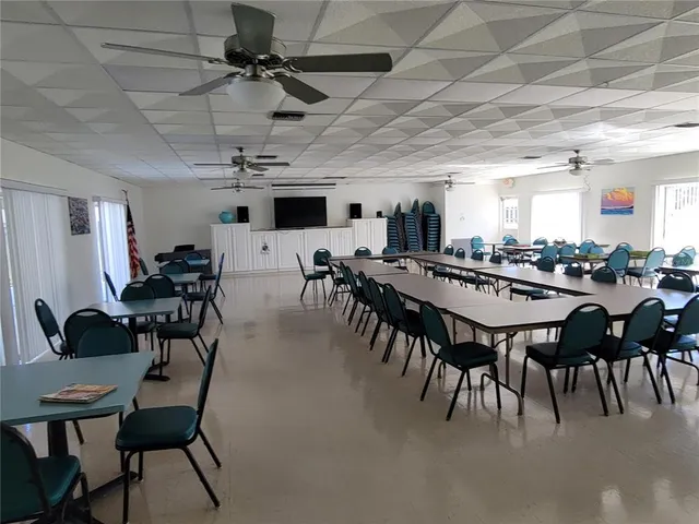a reading room with furniture and book shelf