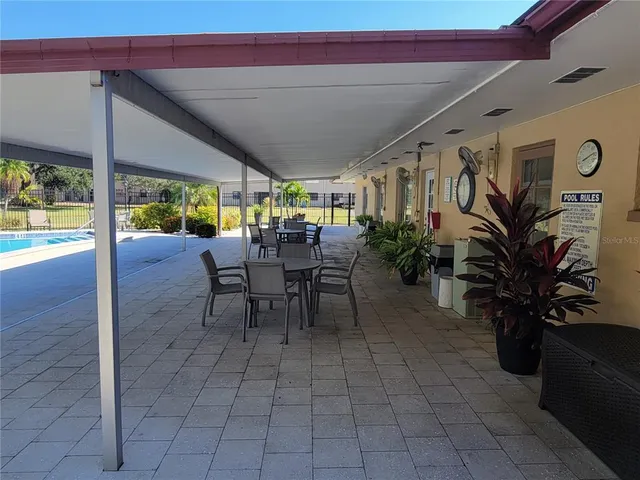 a view of swimming pool with outdoor seating