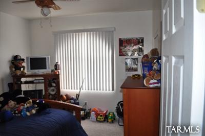1415 Calle Monclova Rio Rico, AZ 85648 - Photo 6 of 16 a living room with furniture and a flat screen tv