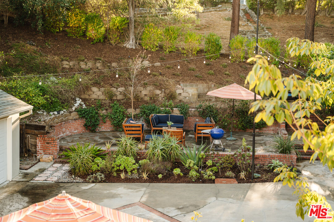 1465 Royal Boulevard Glendale, CA 91207 - Photo 58 of 67 a view of a patio with table and chairs potted plants