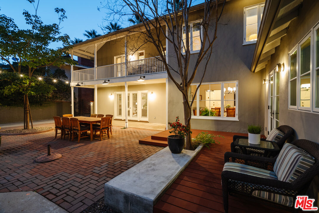 1465 Royal Boulevard Glendale, CA 91207 - Photo 66 of 67 a view of a patio with couches table and chairs and potted plants