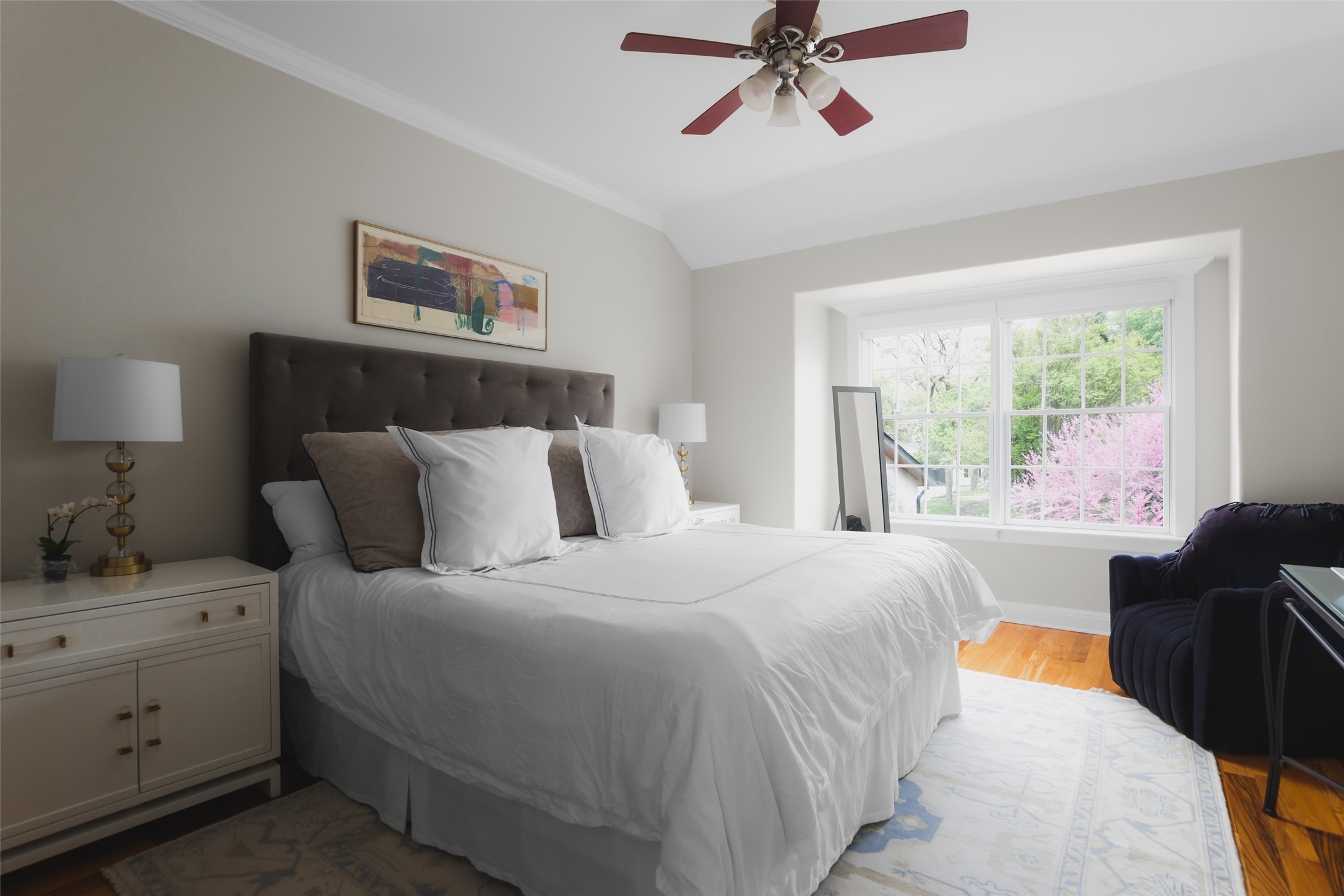 1711 West 29th Street, Unit 2 Austin, TX 78703 - Photo 3 of 6 a bedroom with a bed and wooden floor