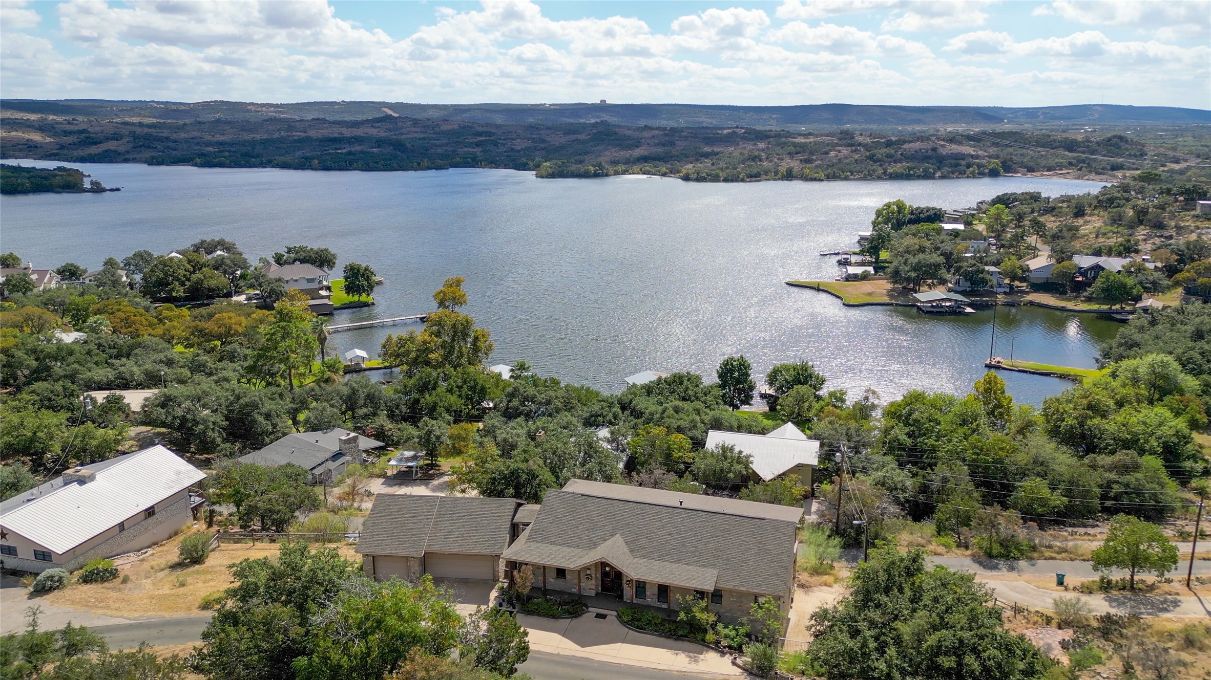 an aerial view of a house with a lake view