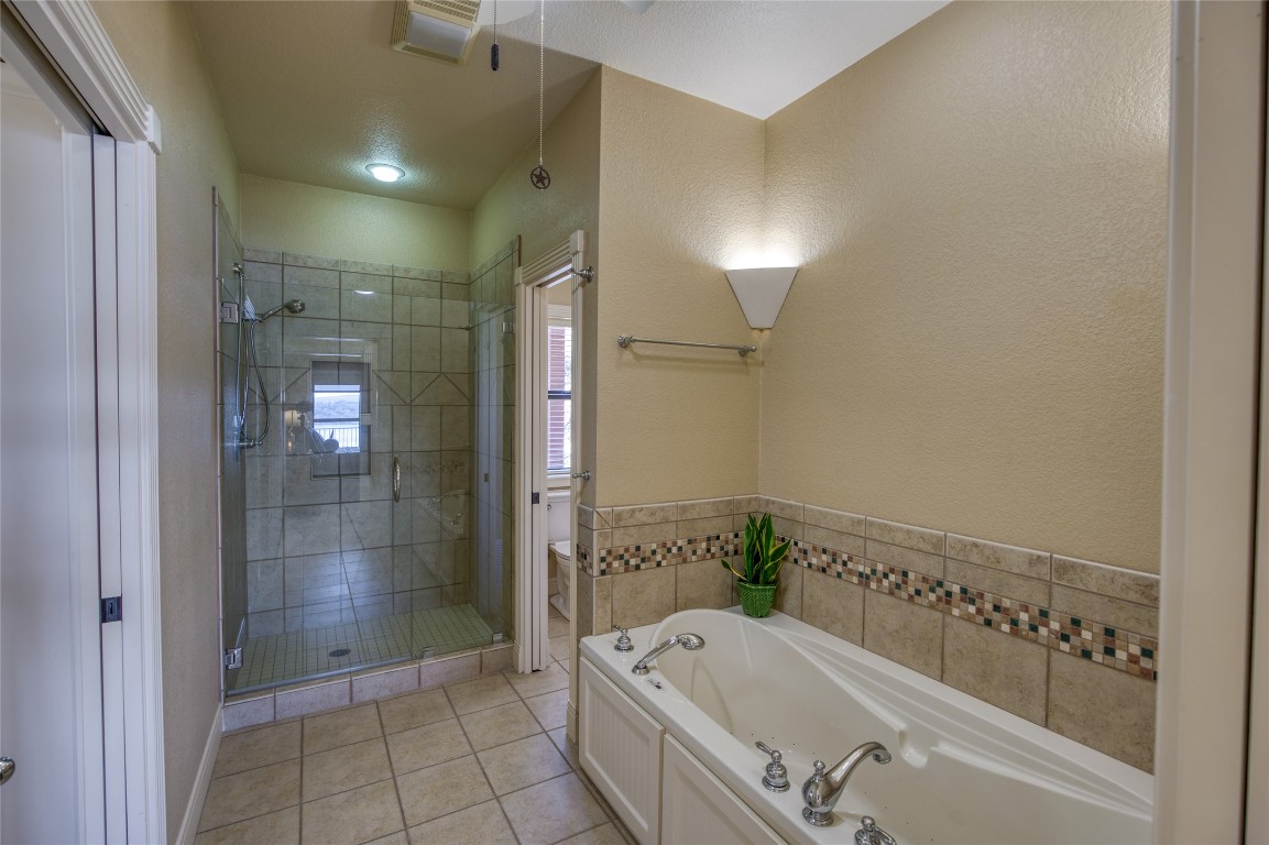 604 North Inwood Road Buchanan Dam, TX 78611 - Photo 19 of 35 The primary has a soaking tub and walk in shower