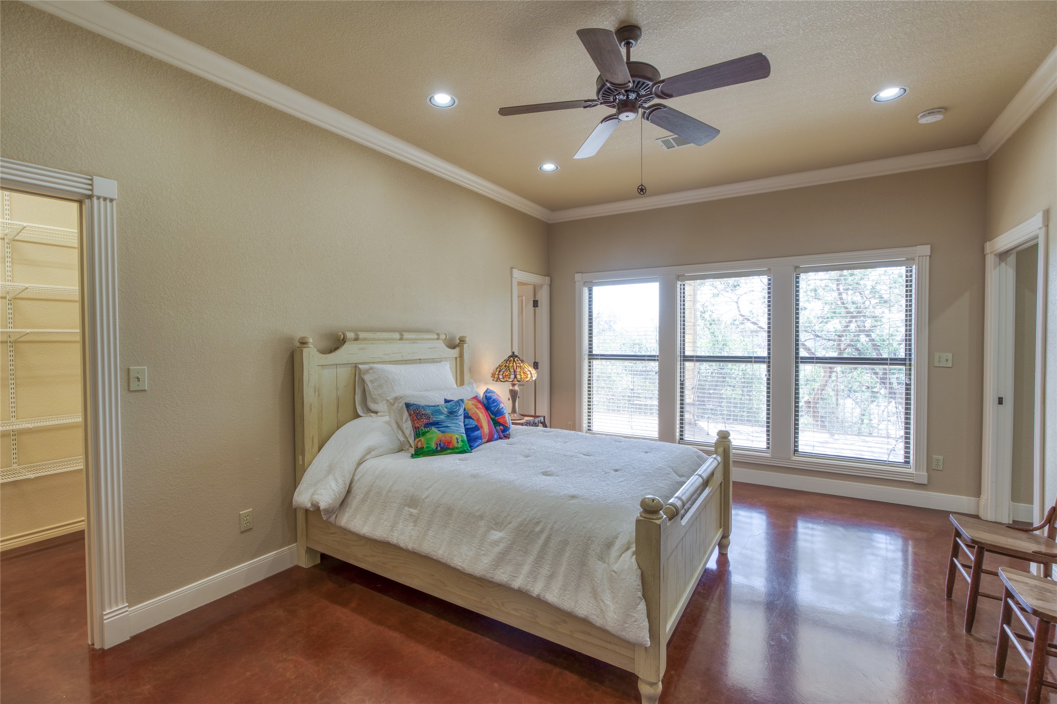 604 North Inwood Road Buchanan Dam, TX 78611 - Photo 22 of 35 a bedroom with a bed and a large window