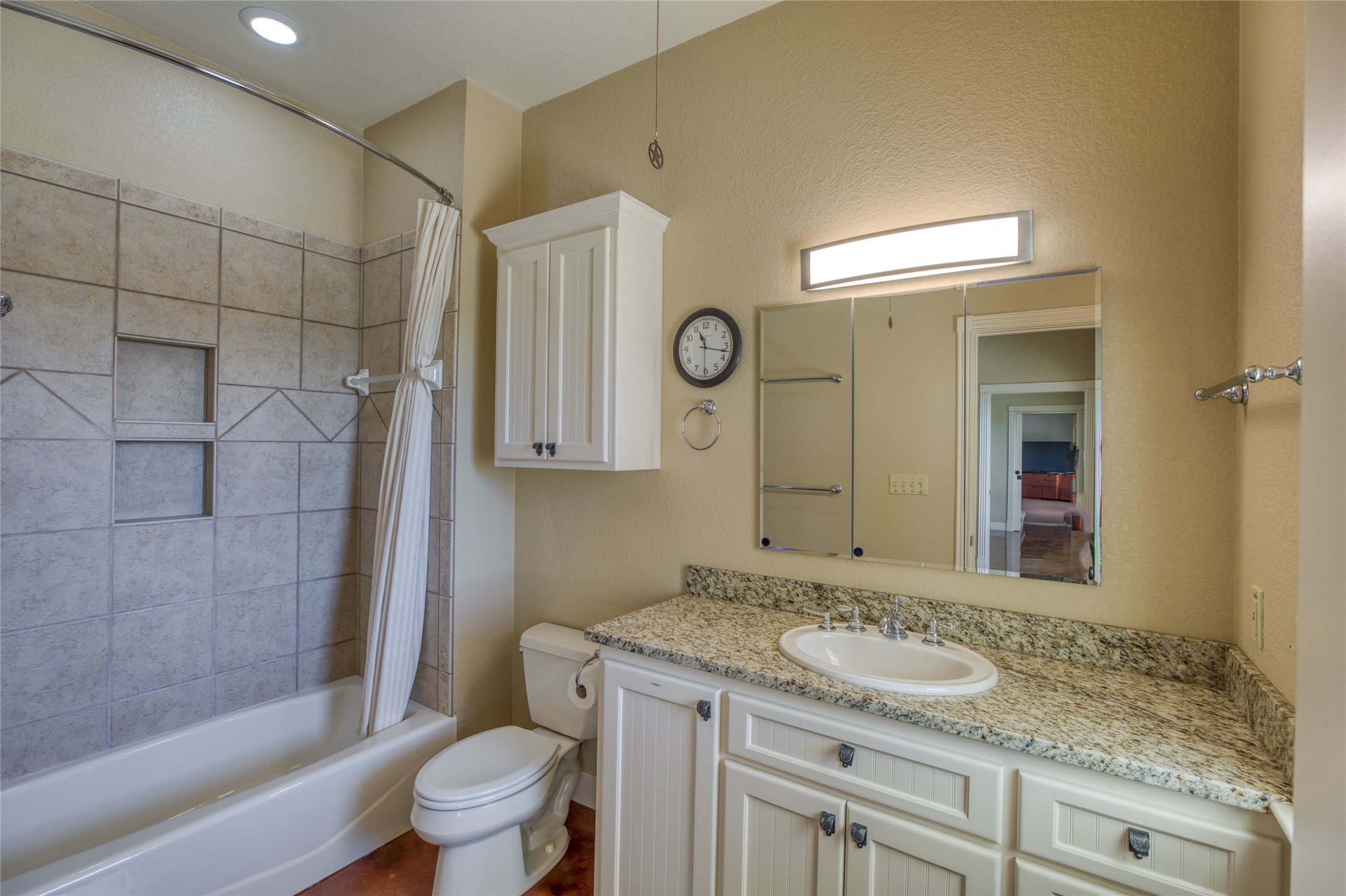 604 North Inwood Road Buchanan Dam, TX 78611 - Photo 23 of 35 a bathroom with a granite countertop sink toilet and shower