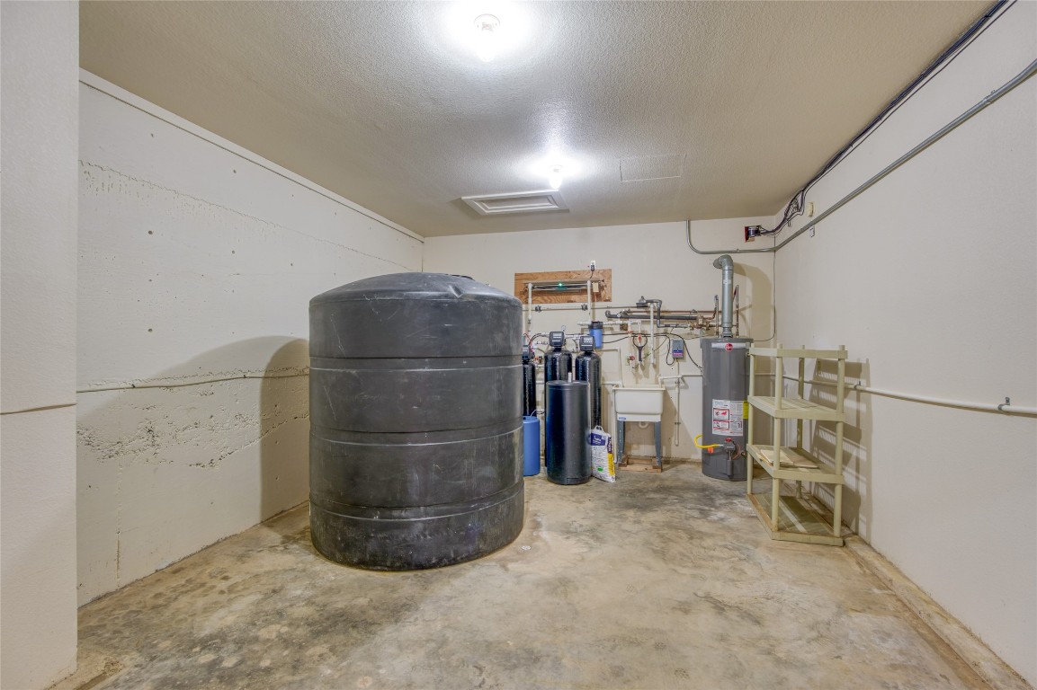 604 North Inwood Road Buchanan Dam, TX 78611 - Photo 27 of 35 water filtration room with a 1000 gallon storage tank