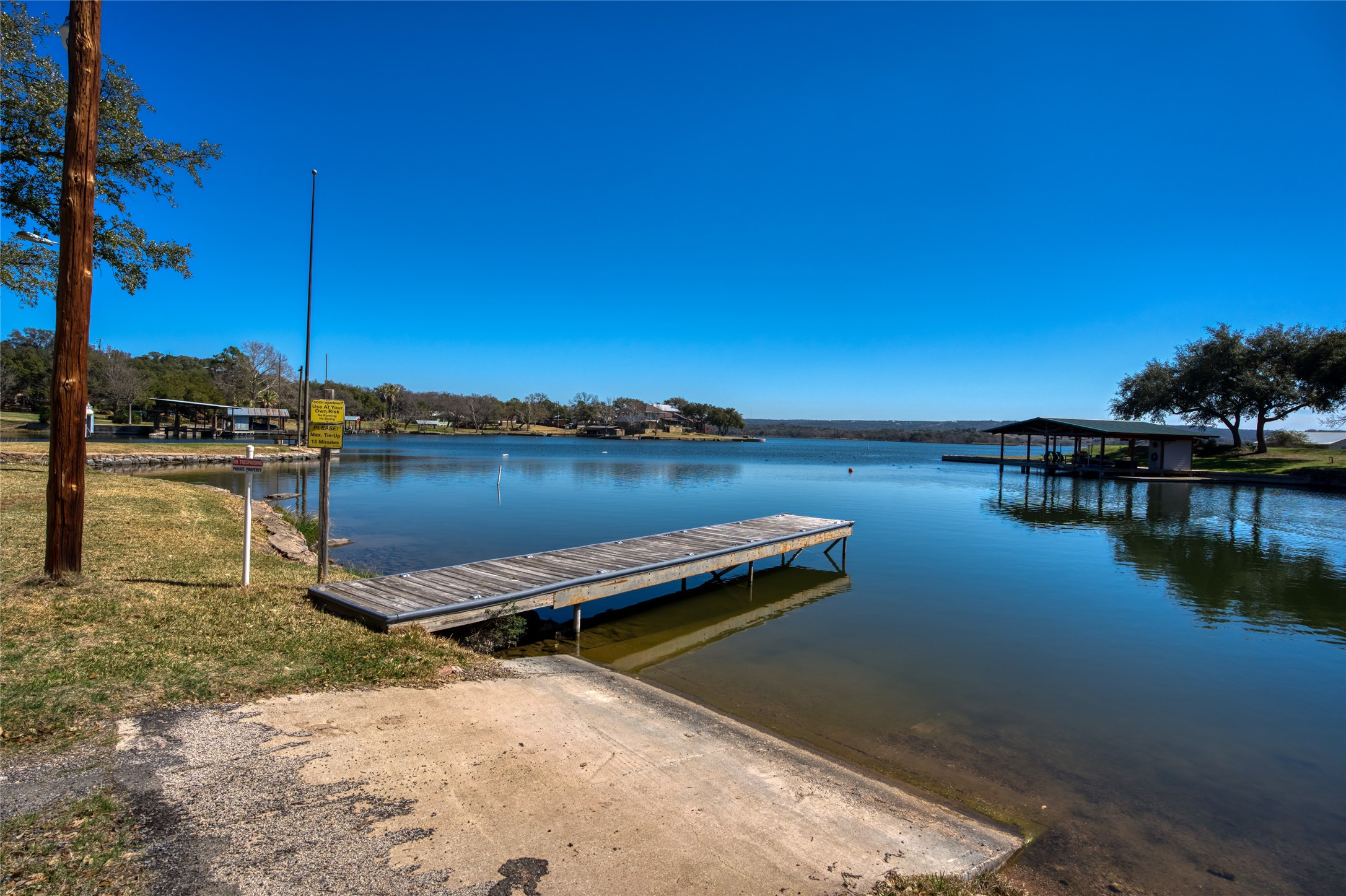 604 North Inwood Road Buchanan Dam, TX 78611 - Photo 33 of 35 a view of a lake with boats and trees in the background