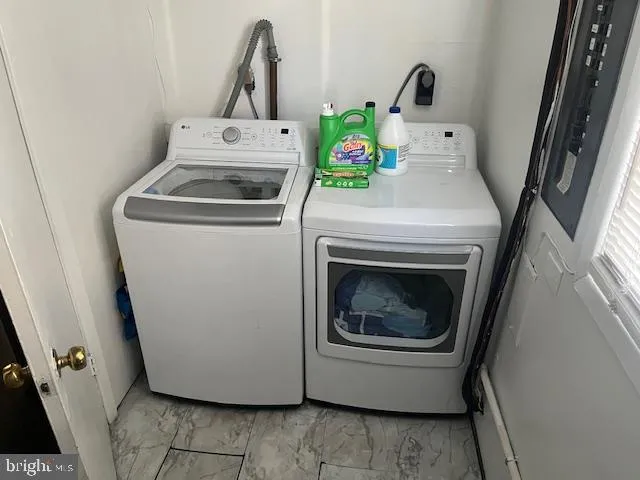 a utility room with dryer and washer