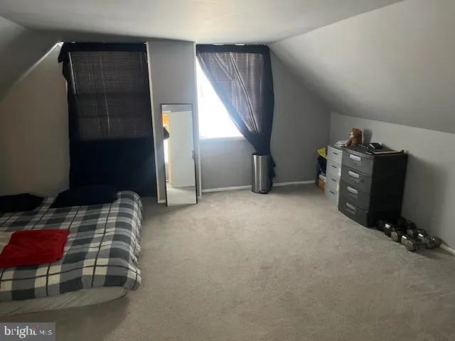 a room with furniture and a flat screen tv