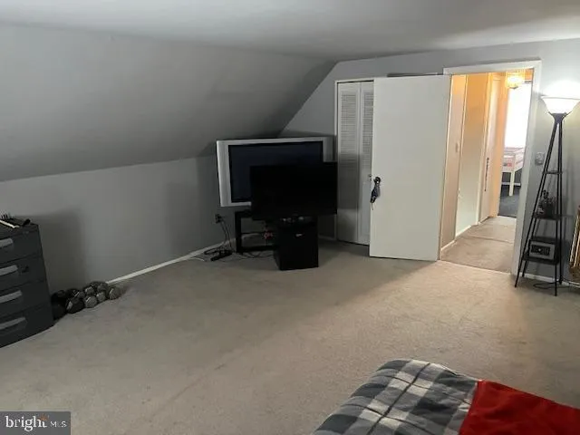 a view of livingroom with furniture and a window
