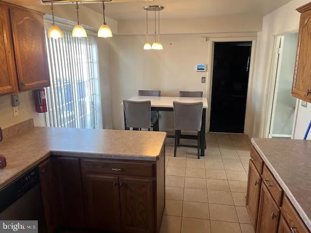 a kitchen with a sink cabinets and window