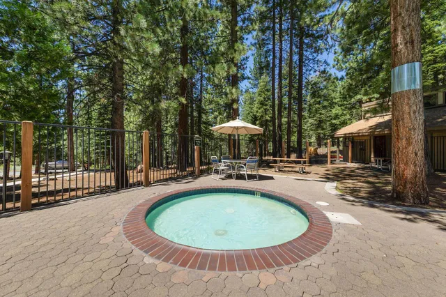 a view of a swimming pool with a patio