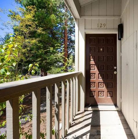 a view of balcony with wooden floor